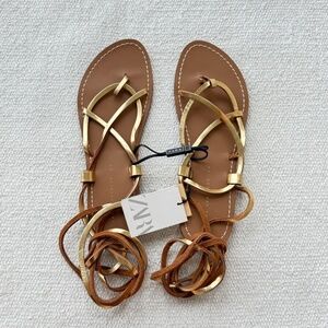NWT- ZARA LACE UP FLAT SANDALS Gold